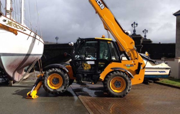 Boat moving and lifting trusses onto new build house